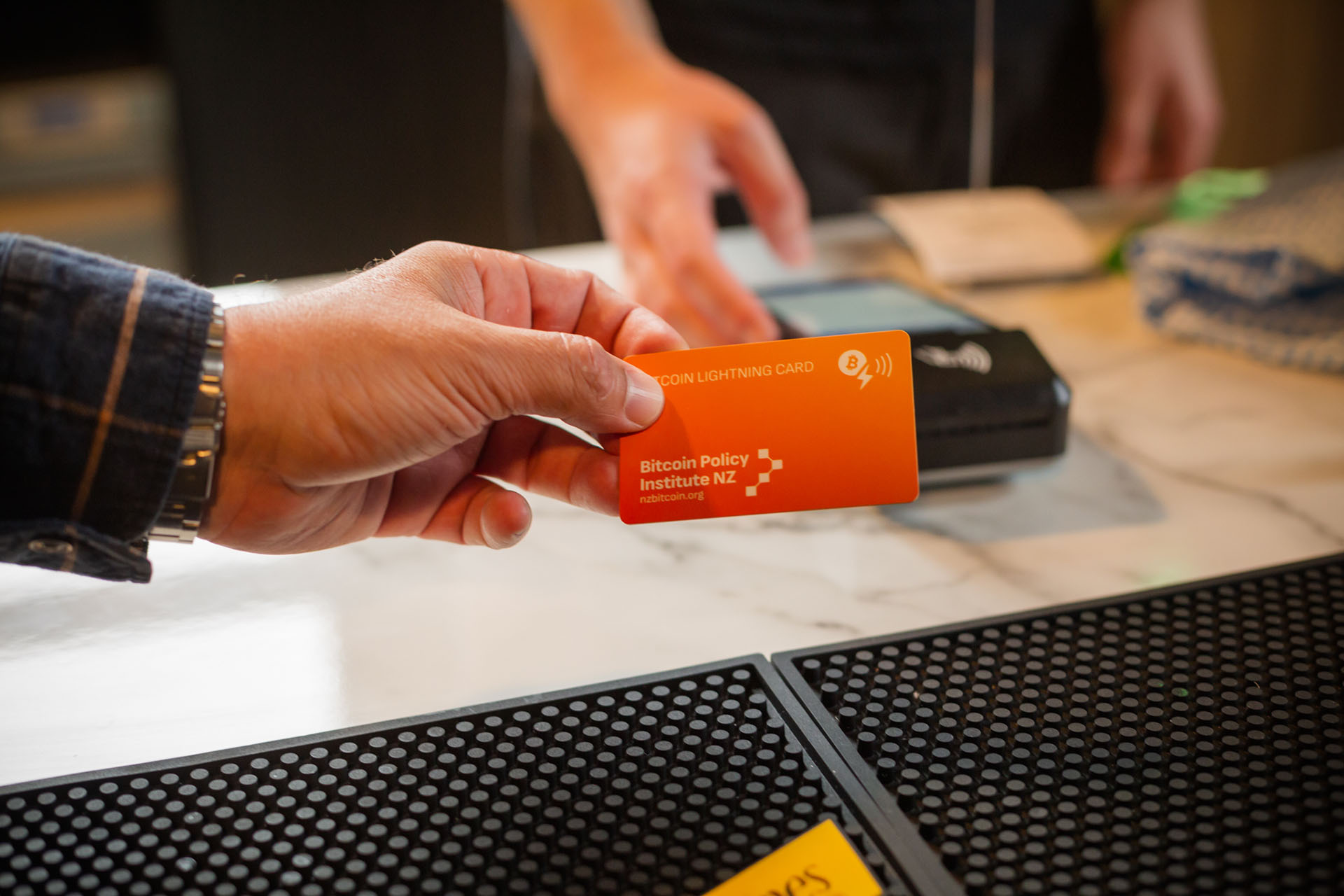 A Bitcoin Lightning card being used for payments